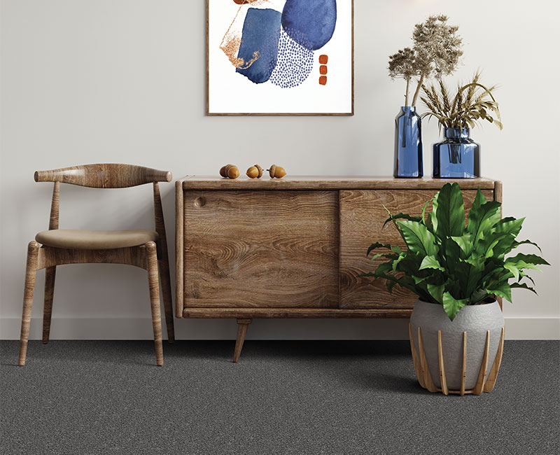 carpet in entryway with wood decor.
