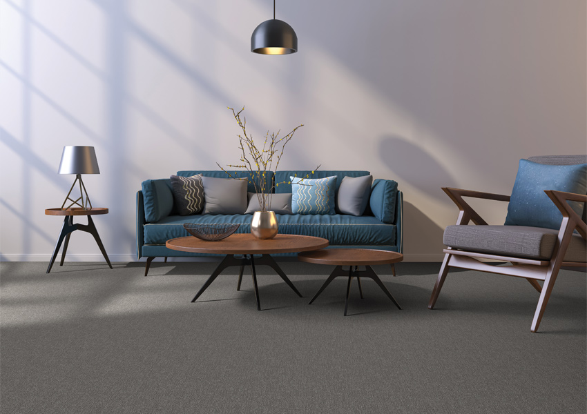 dark grey carpet in living room with midcentury modern decor.